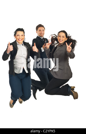 Three business people jumping giving thumbs up and showing victory sign isolated on white background Stock Photo