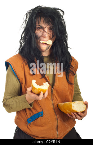 Happy beggar woman eating bread isolated on white background Stock Photo