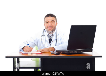 Smiling doctor in office writing on papers isolated on white Stock Photo