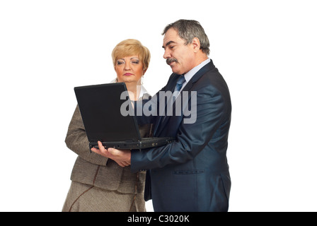 Mature business people using laptop and having conversation together isolated on white background Stock Photo