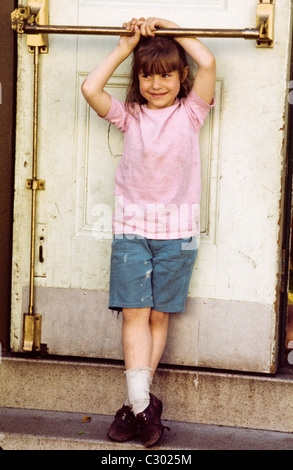 San Francisco, California. Little Girl plays in doorway of   Jamestown Youth Center  © Bob Kreisel Stock Photo