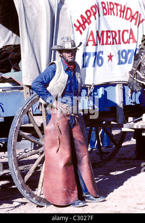 Cowboy outrider posing  photograph in front of Calistoga wagon on BiCentennial wagon train celebrating Americas 200th birthday Stock Photo