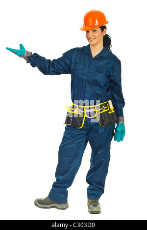 Beauty constructor worker woman in protective uniform welcome you to copy space isolated on white background Stock Photo