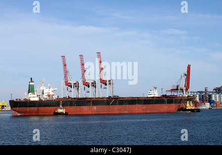 dry cargo ship in a seaport Stock Photo