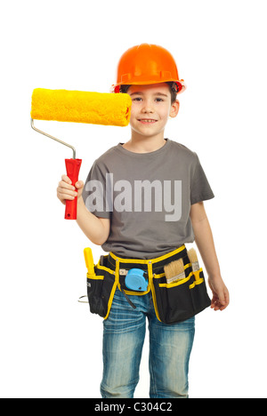 Boy with orange helmet giving paint roller isolated on white background Stock Photo