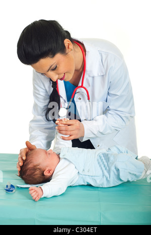 Doctor woman examine a newborn baby six weeks in her office against white background Stock Photo