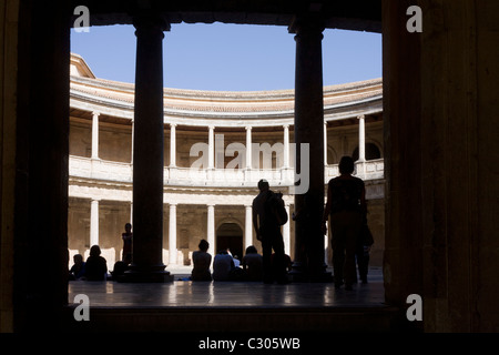 Visitors admire the inner circle of Palacio de Carlos V at Alhambra, Garana. Stock Photo