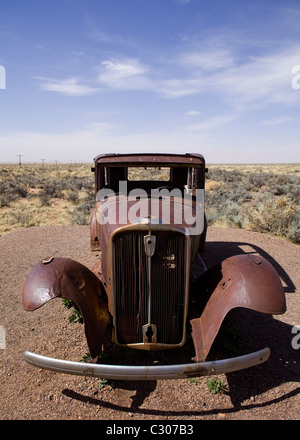 Deserted antique car in the North American desert landscape - Arizona USA Stock Photo