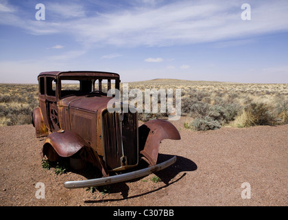 Deserted antique car in the North American desert landscape - Arizona USA Stock Photo