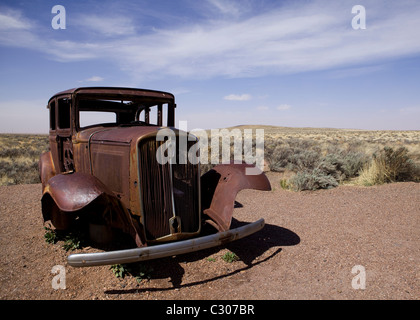 Deserted antique car in the North American desert landscape - Arizona USA Stock Photo