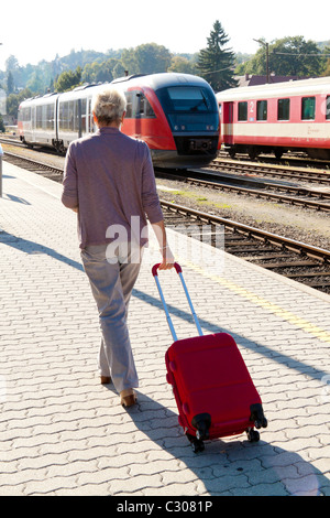 Woman at the railway station Stock Photo
