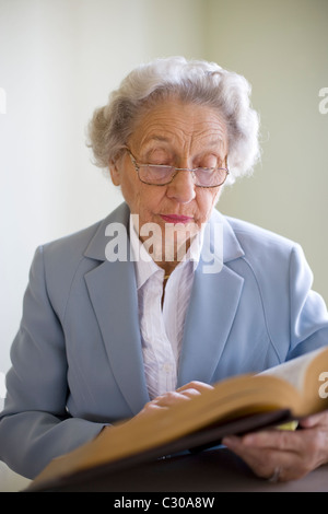 Elderly woman studying the Bible Stock Photo
