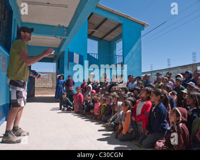School children gathered in schoolyard to visit with Habitat for Humanity Guatemala volunteers and staff. Stock Photo
