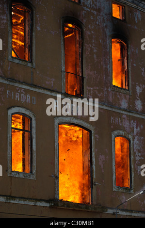 Flames inside burning house Stock Photo