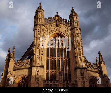 Bath Abbey bathed in warm late afternoon light as the sun momentarily breaks through the clouds. Stock Photo