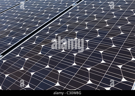 Sanyo solar pv photovoltaic panels on house roof Wales UK Stock Photo
