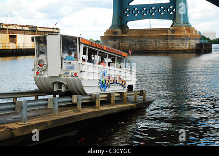 A Duck Mobile enters the Delaware River near the Ben Franklin Bridge in Philadelphia Stock Photo