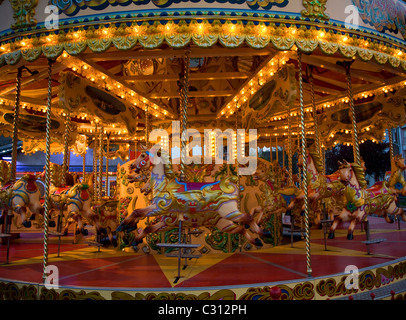 Traditional fairground roundabout horses Electric Palace amusement arcade Weymouth Dorset England Stock Photo