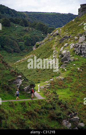 Two walkers on the South West Coast Path near the Valley of Rocks in North Devon  England UK Stock Photo