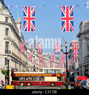 Sightseeing tour bus in Regent Street London with Union Jack flags