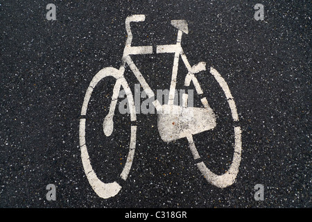 Asphalt road with  white bike  logo Stock Photo