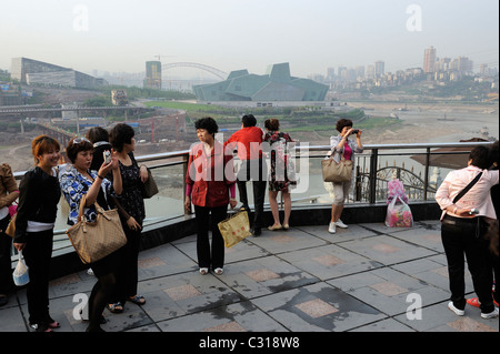 Chinese tourists look at the new opera house in Chongqing, China. 22-Apr-2011 Stock Photo