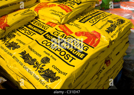 Bags pile Cavering horse manure compost Stock Photo