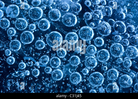 Bubbles trapped in ice, close-up Stock Photo