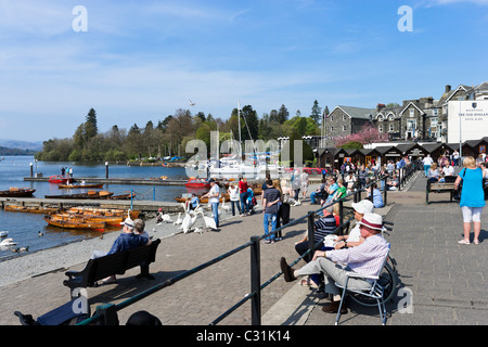 Tourists on the lakefront promenade in Bowness, Lake Windermere, Lake District National Park, Cumbria, UK Stock Photo