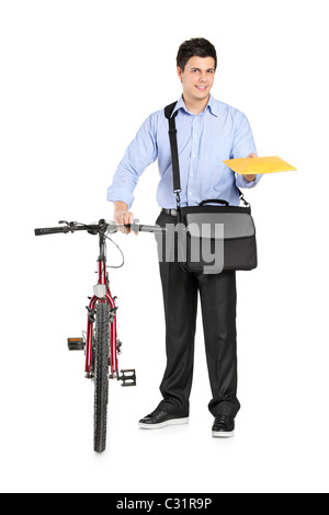 Mail man next to a bicycle holding an envelope Stock Photo