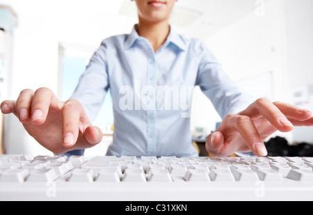 Photo of woman’s hands over keyboard in the office Stock Photo