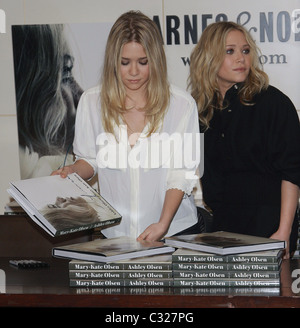 Mary Kate Olsen and Ashley Olsen The Olsen twins sign their new book 'Influence' at Barnes & Noble New York City, USA - Stock Photo