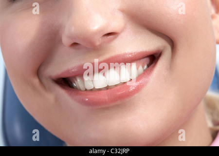 Close-up of happy female showing her healthy teeth in smile Stock Photo