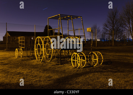 Child climbing frame in a play area at night