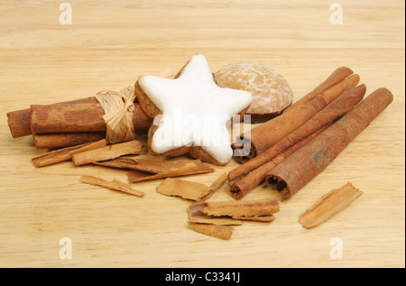 Cinnamon spice and cinnamon flavored lebkuchen biscuits on a wooden board Stock Photo