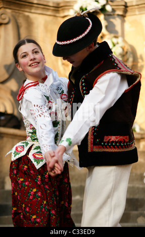 Two young dancers folklore dancing national costume girl boy Eater in Central Slovakia at street of Banska Bystrica town Stock Photo