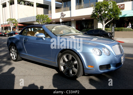 Paris Hilton arrives at the Ivy restaurant in her blue Bentley while wearing a matching blue outfit Los Angeles, California - Stock Photo