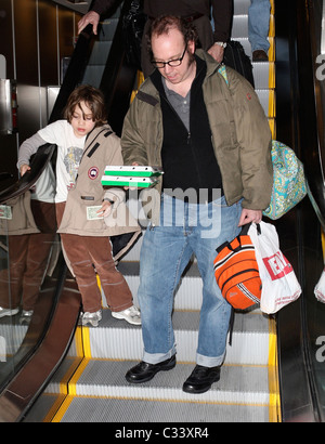 Cold Souls' star Paul Giamatti, carrying luggage and food from Sbarro, arrives at Salt Lake City airport with his son, Samuel Stock Photo