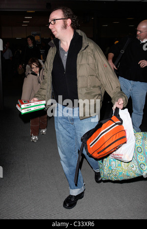 Cold Souls' star Paul Giamatti, carrying luggage and food from Sbarro, arrives at Salt Lake City airport with his son for the Stock Photo