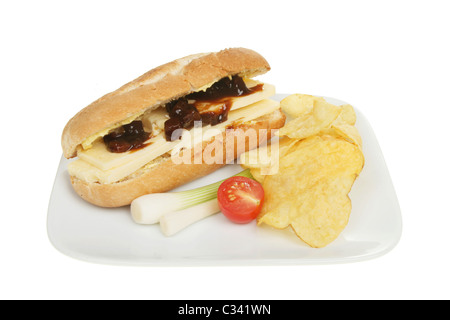 Cheese and pickle baguette with garnish on a plate Stock Photo