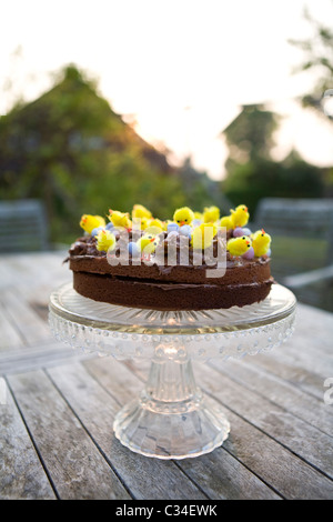 Easter cake covered in chicks and nests Stock Photo