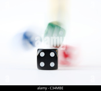 Multi colored dice rolling Stock Photo