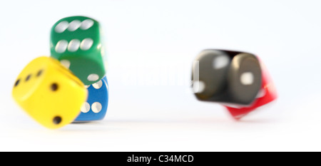 Multi colored dice rolling Stock Photo