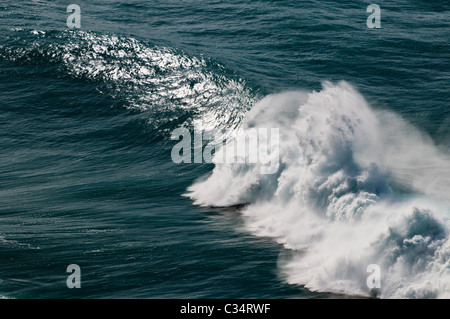 Large winter storm surf breaking off the Na Pali coast, Kauai, Hawaii Stock Photo