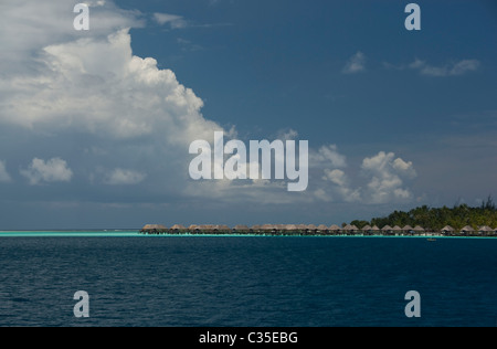 Overwater bungalows Pearl Beach resort Bora Bora French Polynesia Stock Photo