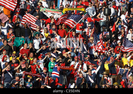 Spectators cheer at a FIFA World Cup football match between Slovenia and the United States June 18, 2010 at Ellis Park Stadium Stock Photo