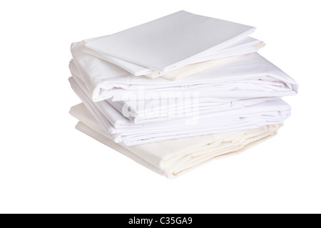 pile or stack of cotton white bed sheets Stock Photo