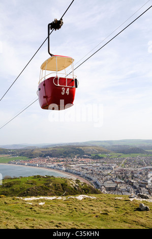 Red cable car over the Great Orme in Llandudno with the town in the background Stock Photo