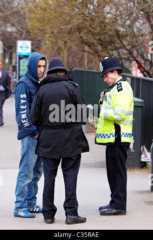 Mosab Abubregh (left) was stopped and questioned by police. The reason given was that he was praying in the street by himself. Stock Photo