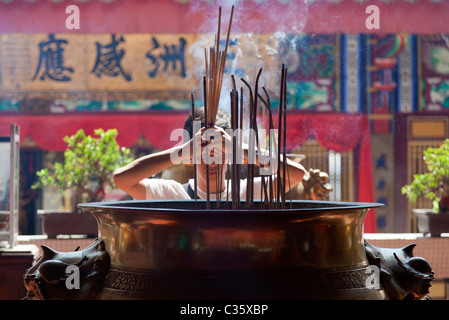 Kek Sok Si Temple, Penang Malaysia - making offerings 1 Stock Photo